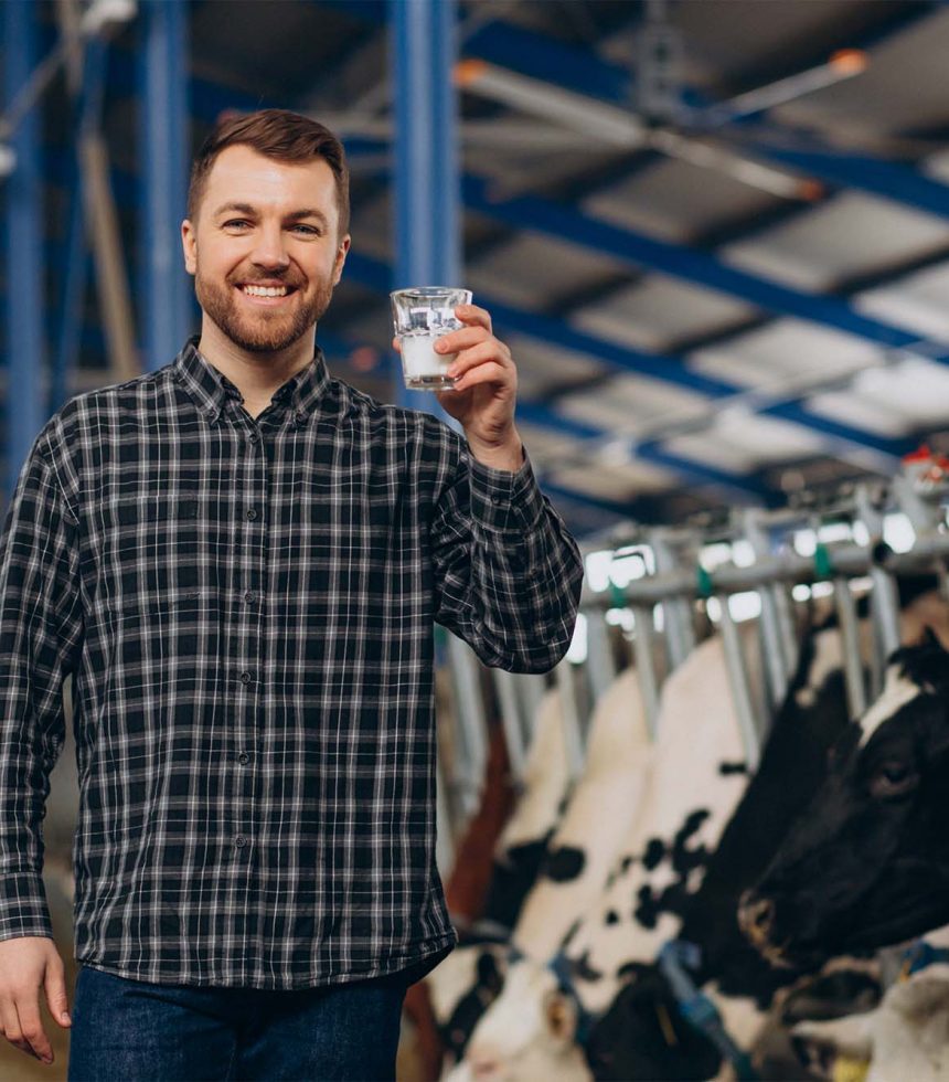 man-farmer-cowshed-drinking-milk